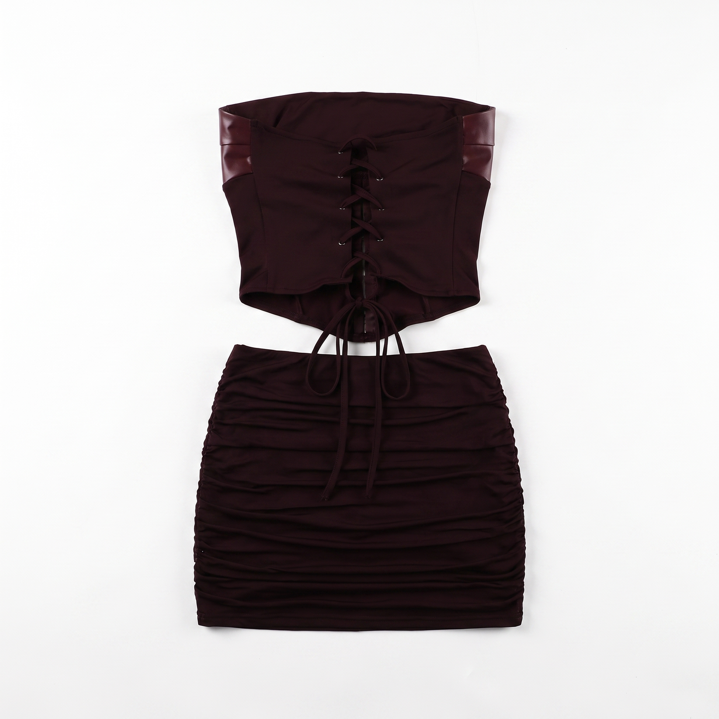 Sunoire fashionable hollow out bodycon strapless backless tube top mini pleated skirt leather pu 2 piece women set garment flatlay 01