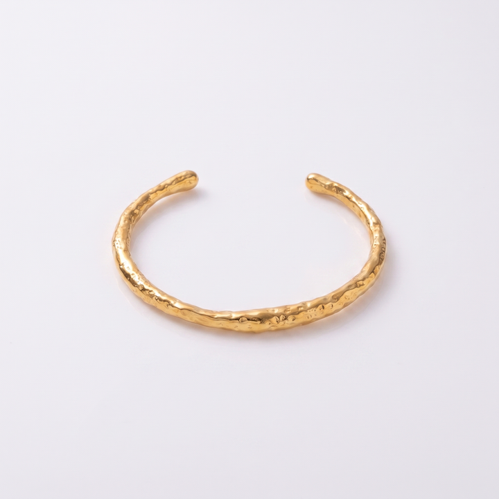 Sunoire j d alluring stainless steel women jewelry bangle 18k gold irregular textured open bangle bracelet 01 flatlay gold