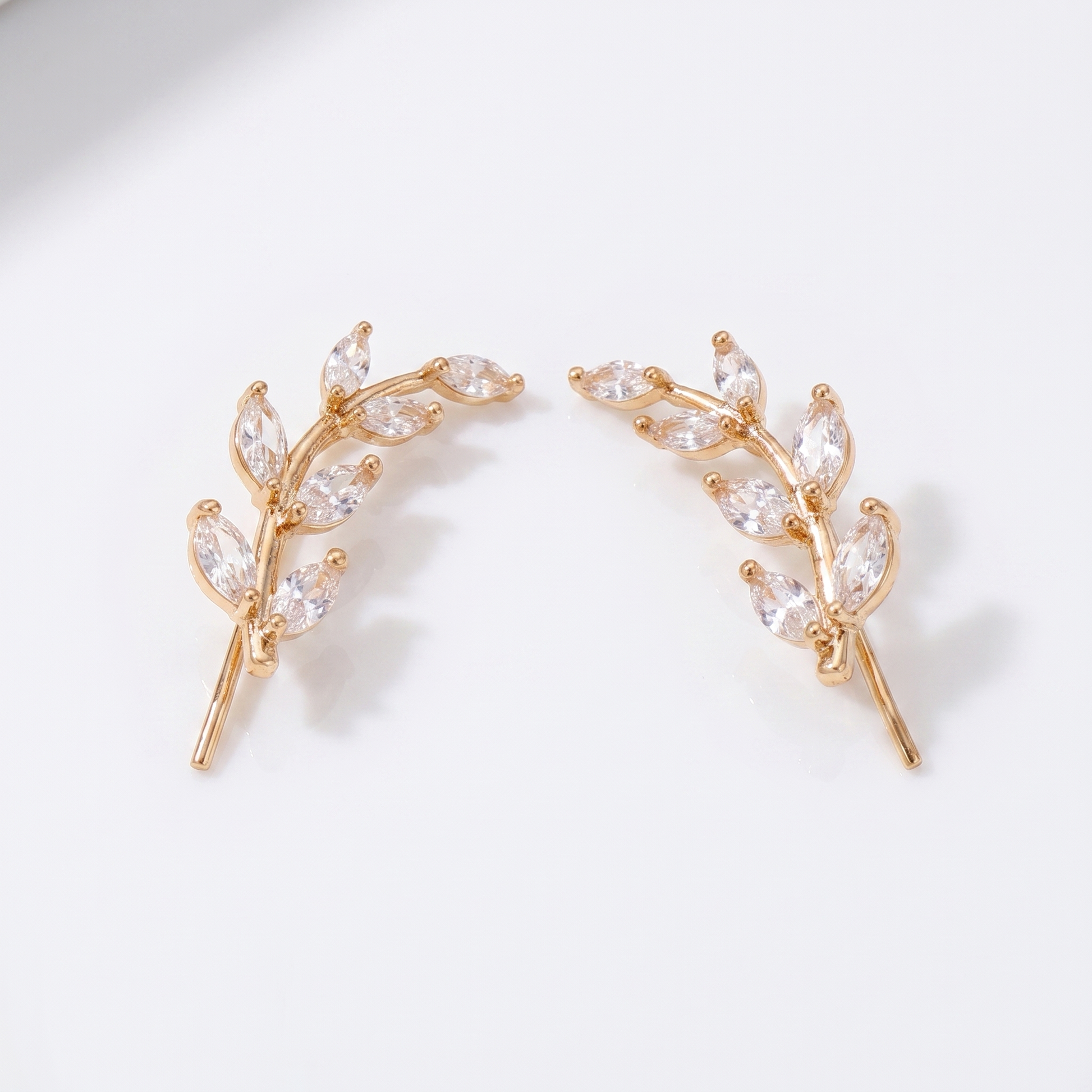 Sunoire fashionable women s earrings premium leaf style earrings with diamond accents suitable for sensitive ears as an accessory 01 flatlay gold