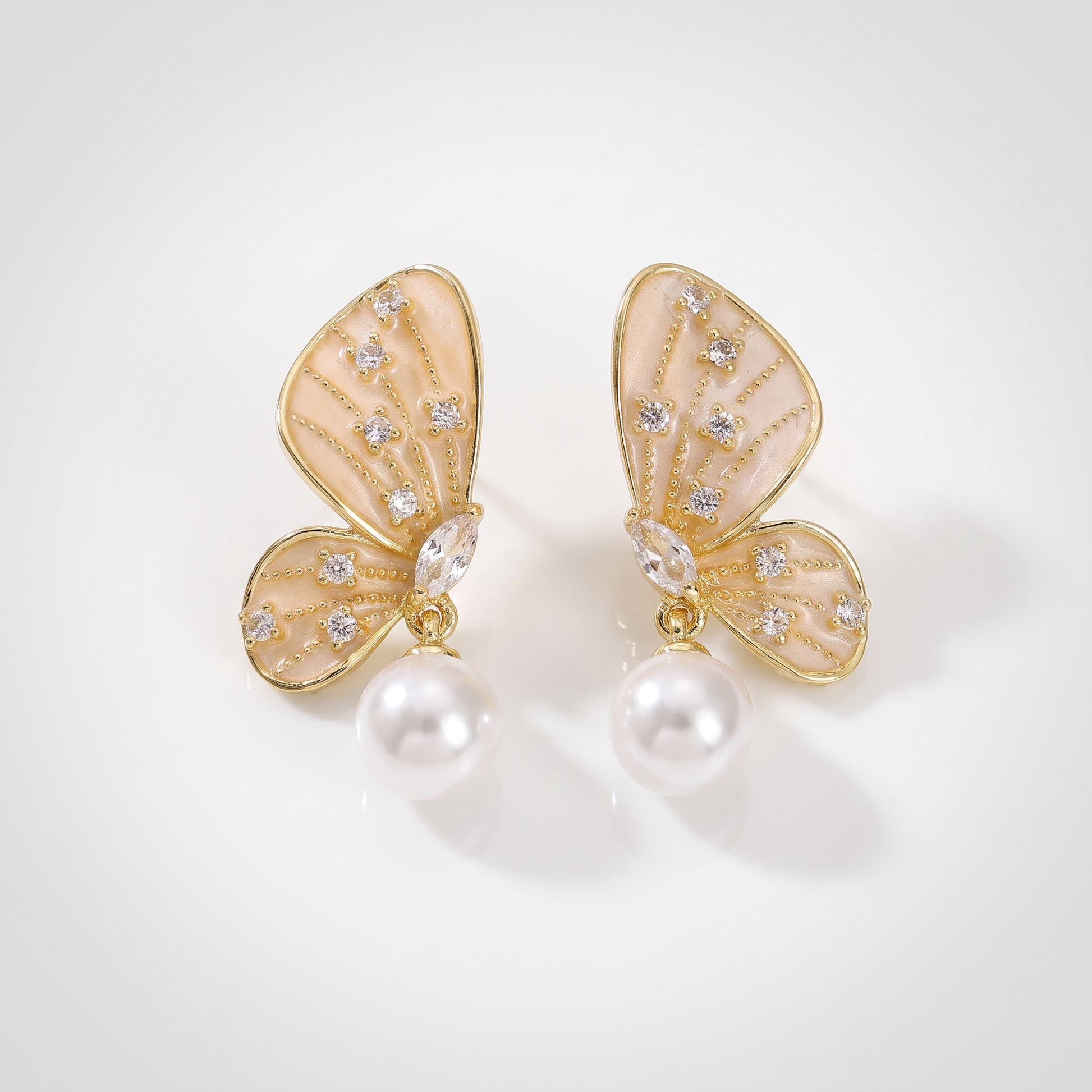 Sunoire elegant trendy gold plated pearl zircon symmetric butterfly earrings for women fashionable drop earrings with brass material 01 flatlay gold