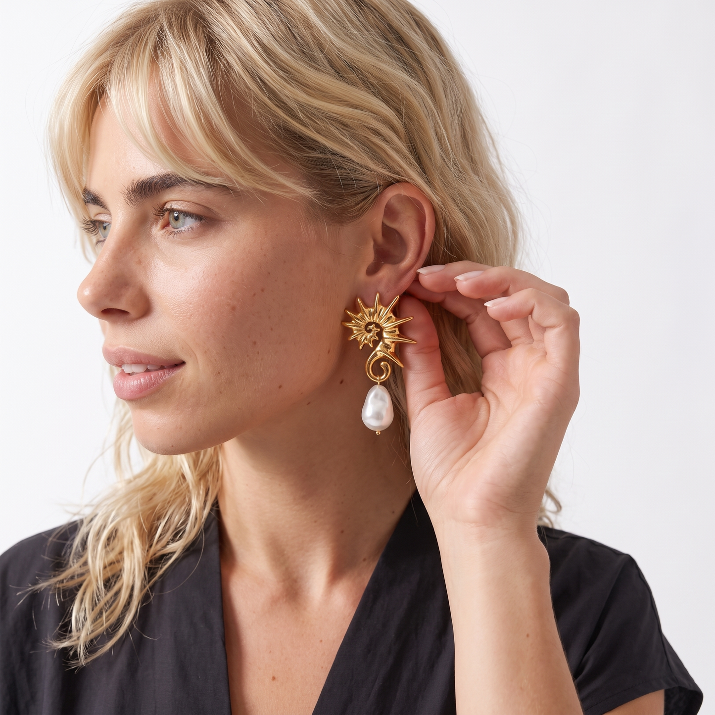 Sunoire yw fashion 18k gold stainless steel seahorse pendant earrings trendy irregular pearl jewelry for women 02 model wearing gold