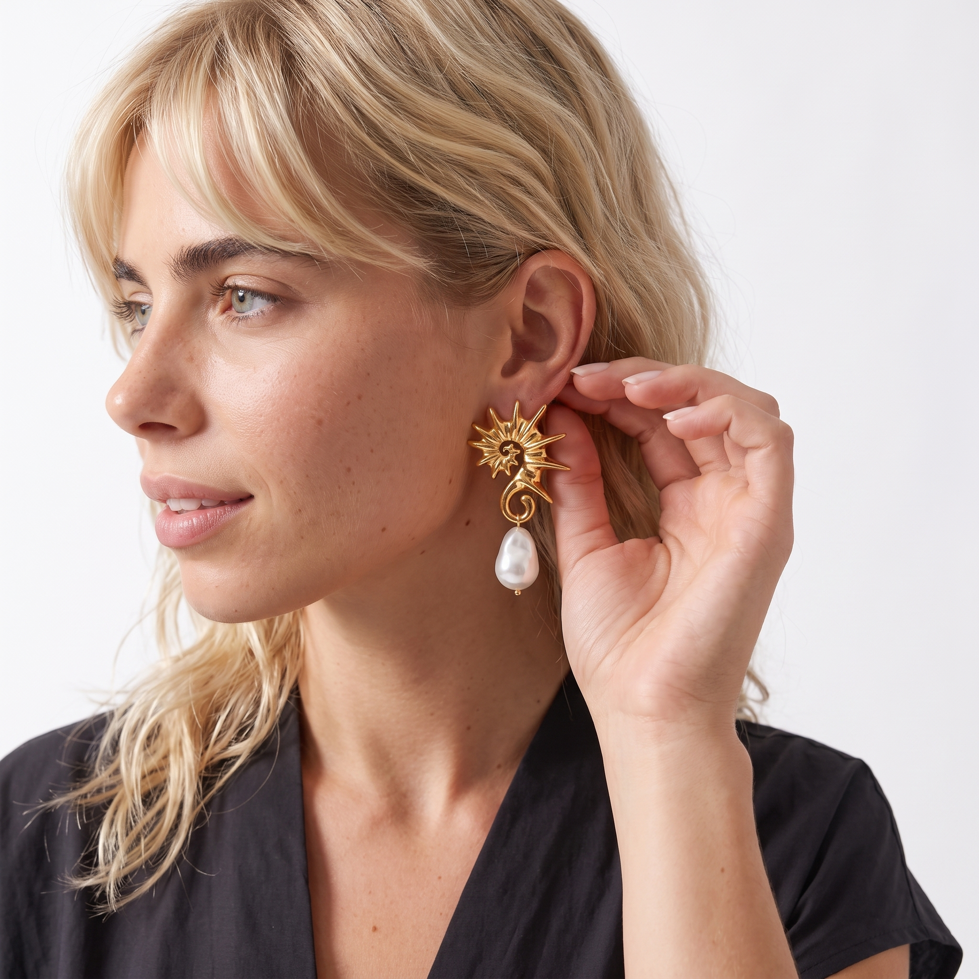 Sunoire yw fashion 18k gold stainless steel seahorse pendant earrings trendy irregular pearl jewelry for women 02 model wearing gold
