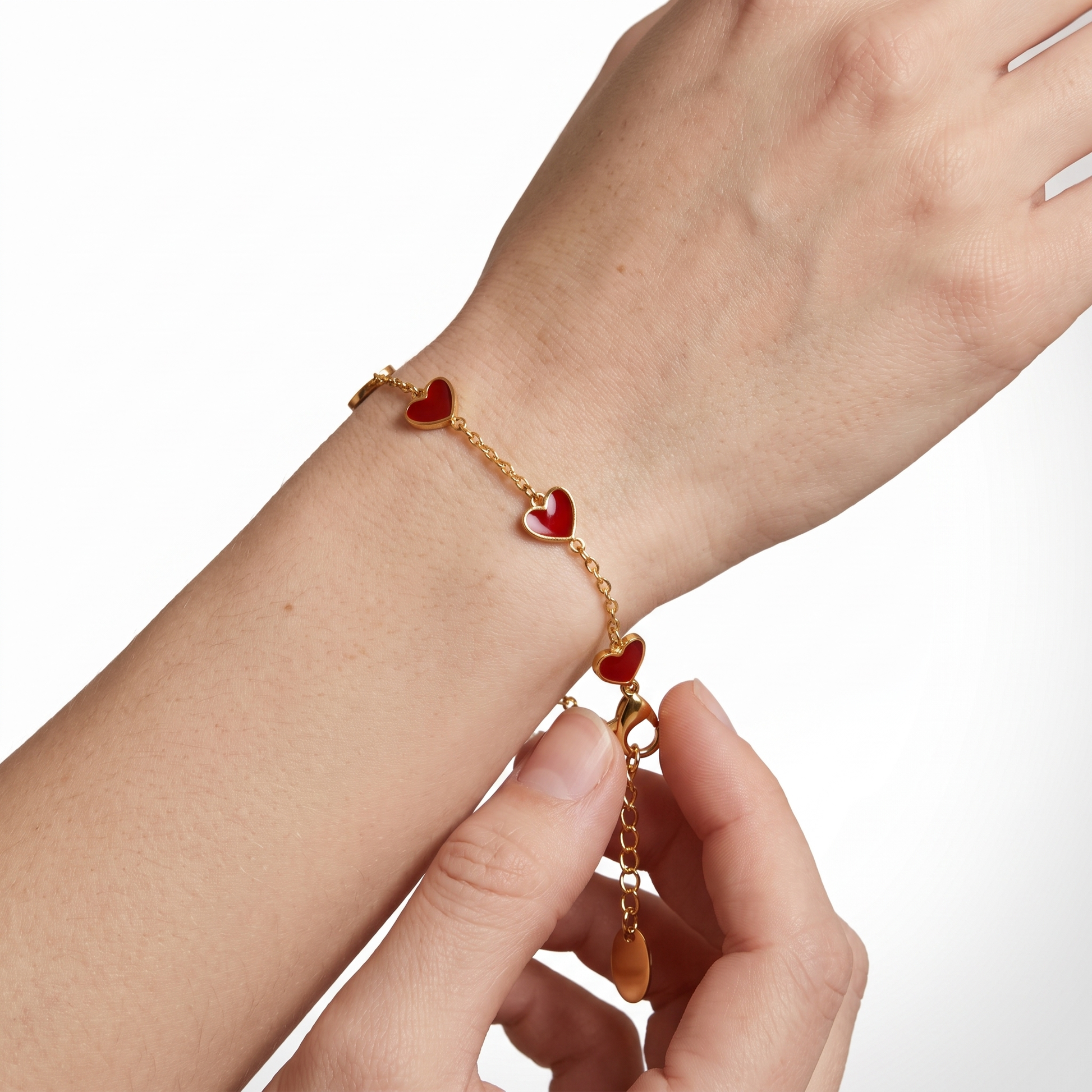 Sunoire fashion five crooked hearts red resin titanium steel 18k gold plated bracelet heart shaped for women tarnish resistant 02 model wearing red