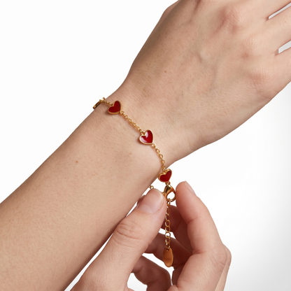 Sunoire fashion five crooked hearts red resin titanium steel 18k gold plated bracelet heart shaped for women tarnish resistant 02 model wearing red