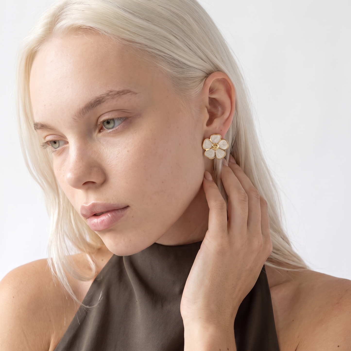 Sunoire women s trendy stainless steel stud earrings minimalist six petaled flower lucky gold color plating wholesale retro party 02 model wearing white