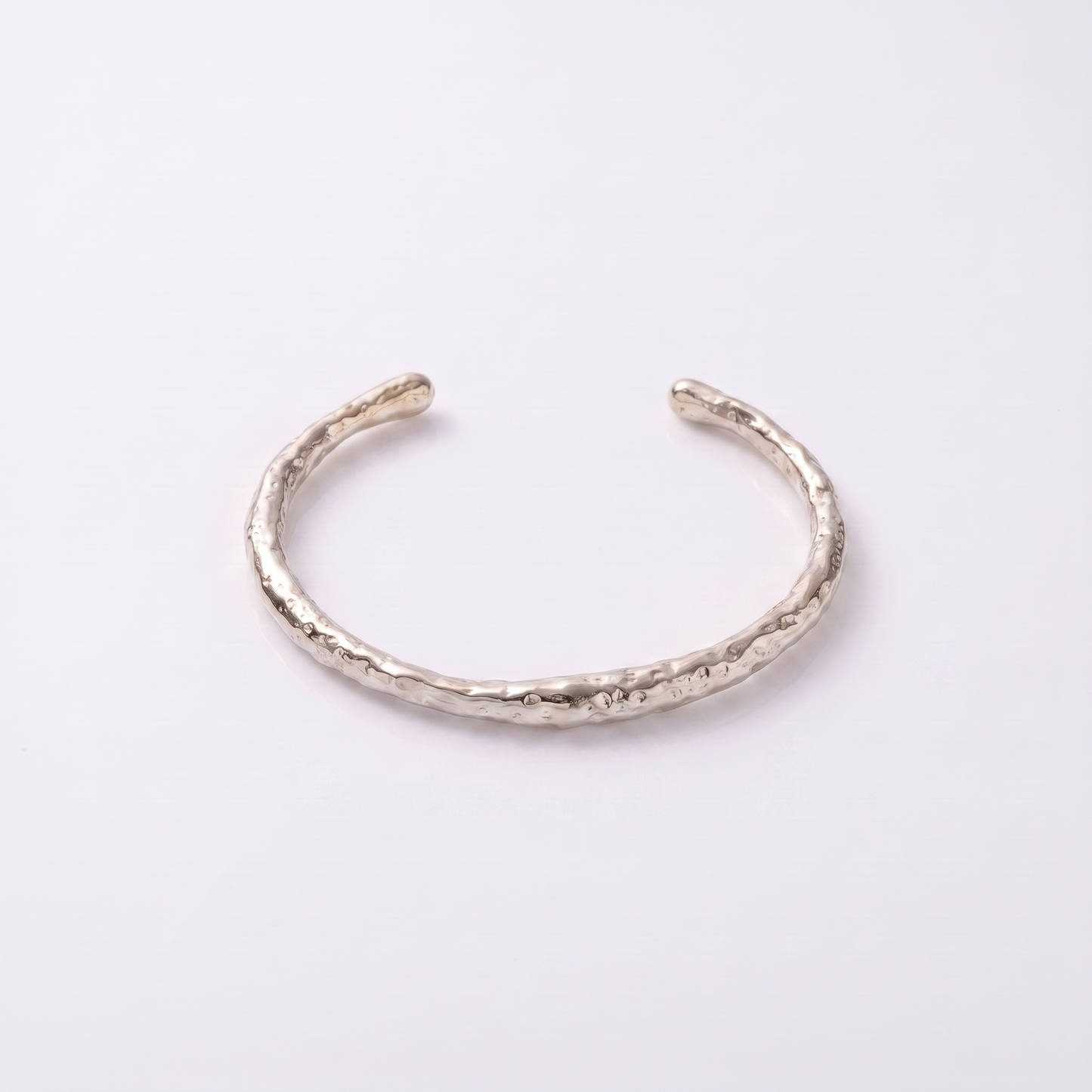 Sunoire j d alluring stainless steel women jewelry bangle 18k gold irregular textured open bangle bracelet 03 flatlay silver