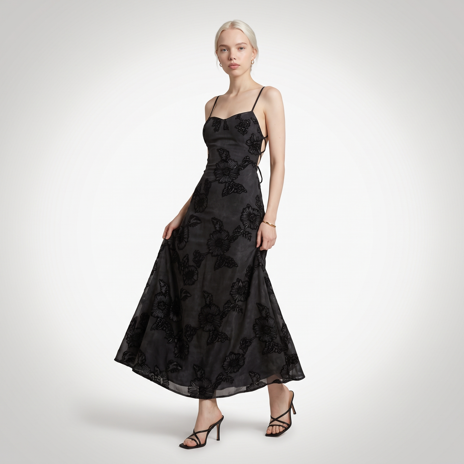 long black floral dress Red/Black Print with Sheer Neckline by Elizabeth K GL2246 2XL / Red Cue the invites and late nights A bright floral print sweeps across this glossy woven dress that falls from slender adjustable spaghetti straps into a surplice bodice with a backless design and a sash tie at the waist Strapless Long Black Prom Dress