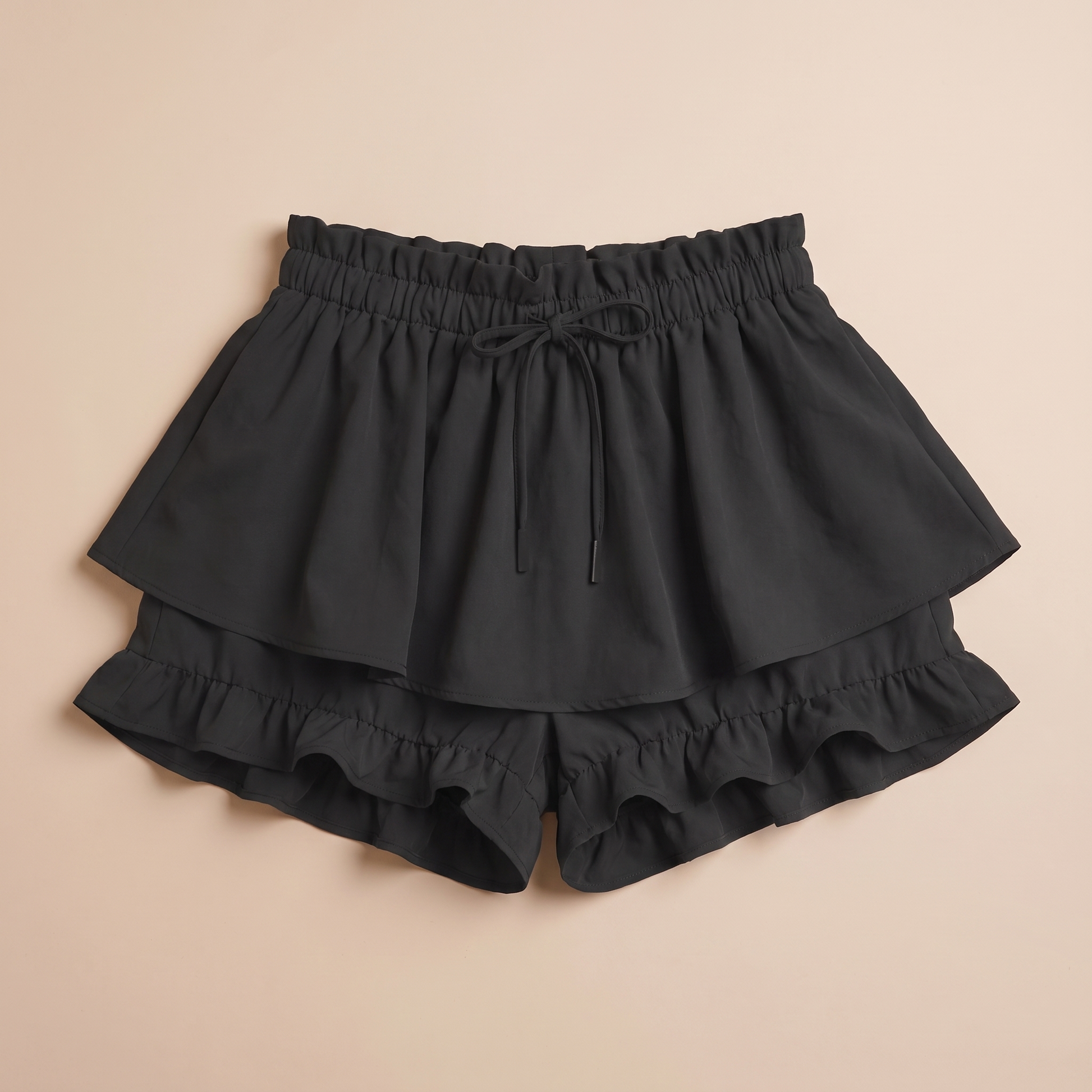 Sunoire alessia black ruffle skirt garment flatlay 01