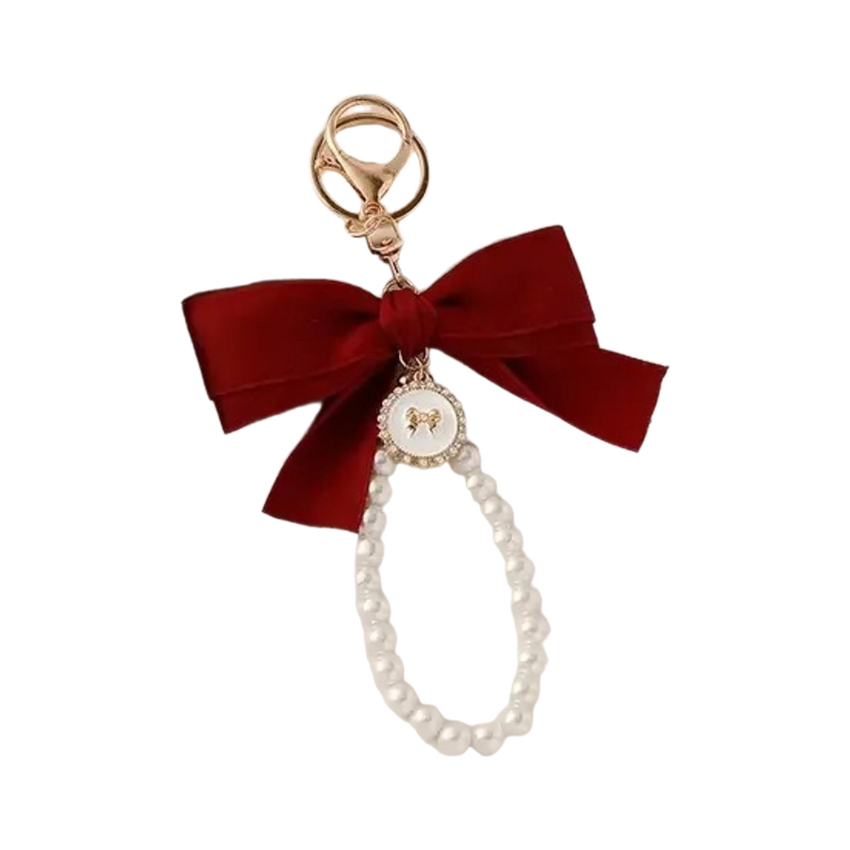 Red ribbon bow bag charm with a faux pearl loop and gold clasp