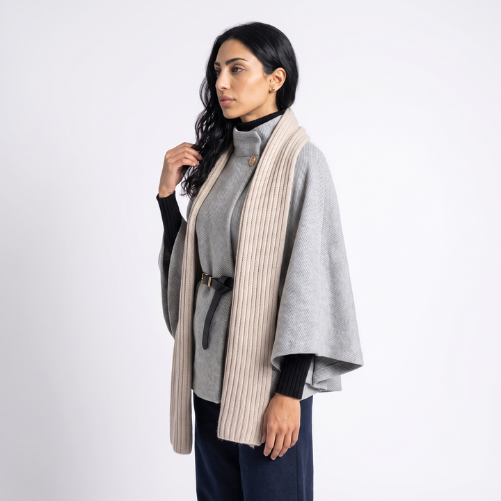 Sunoire chic cape sleeve knit sweater with high neck and gold button top side crop 01