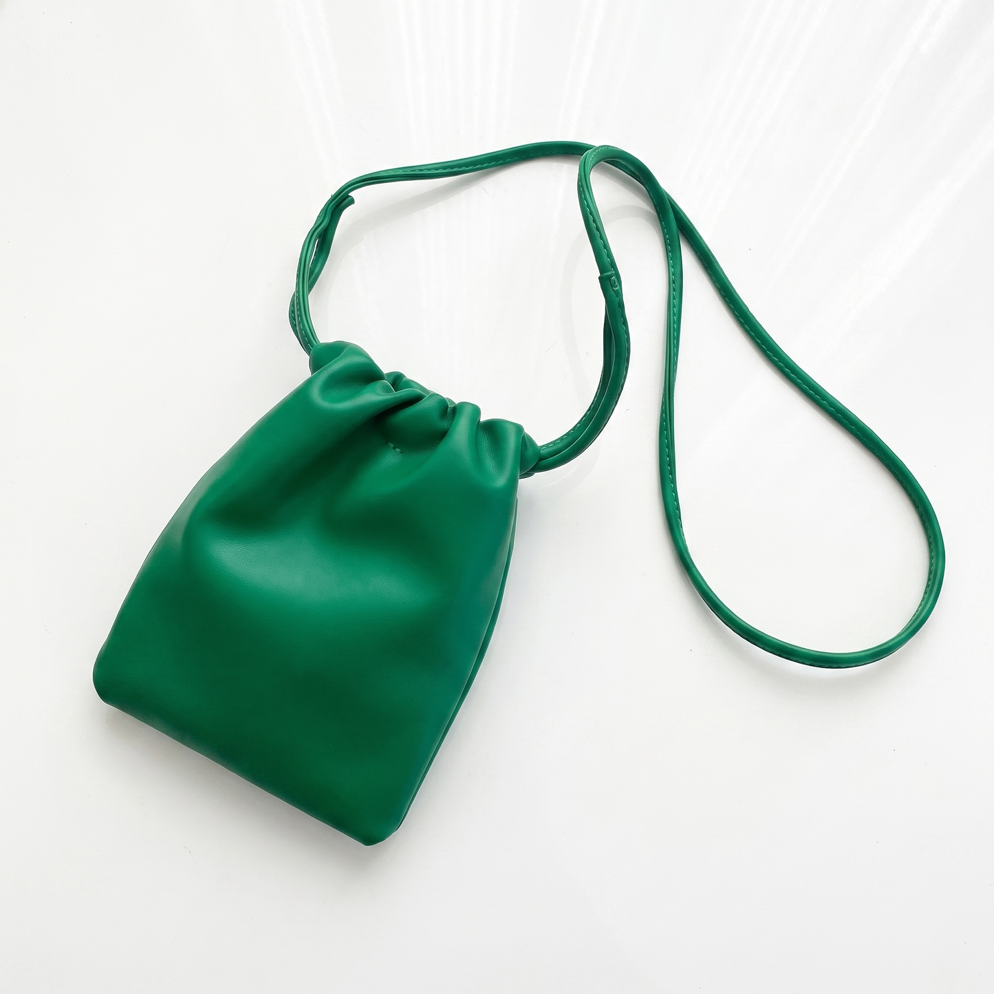 Sunoire mira black drawstring bucket bag colorway dark green front hero 01