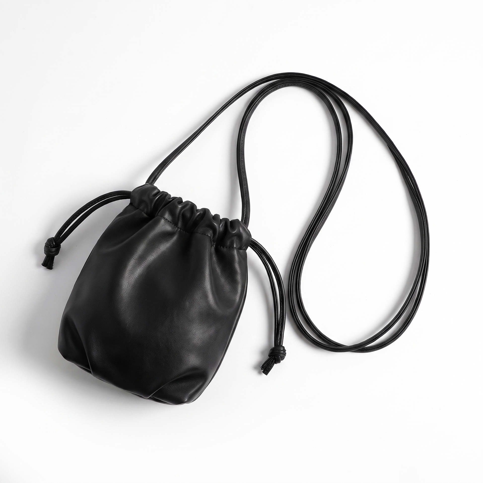 Sunoire mira black drawstring bucket bag front hero 01