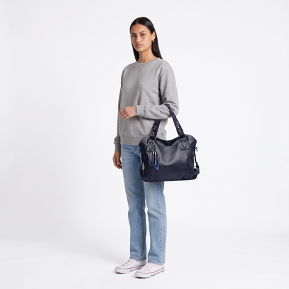 Women's Slouchy Faux Leather Fringe Charm Hobo Bag, worn by a model