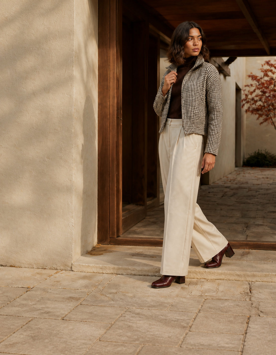 Autumn edit — check jacket, brown turtleneck and wide-leg trousers in warm afternoon light