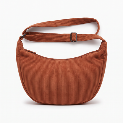 Sunoire tessa rust corduroy crescent bag garment flatlay 01