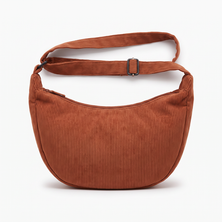 Sunoire tessa rust corduroy crescent bag garment flatlay 01