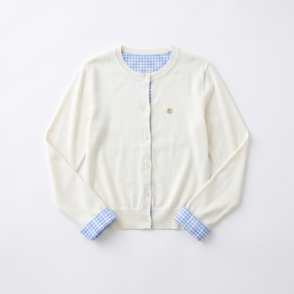 Sunoire vega chang white crew neck blue plaid contrast placket cuff knit cardigan for women fake two piece design small embroidery garment flatlay 01