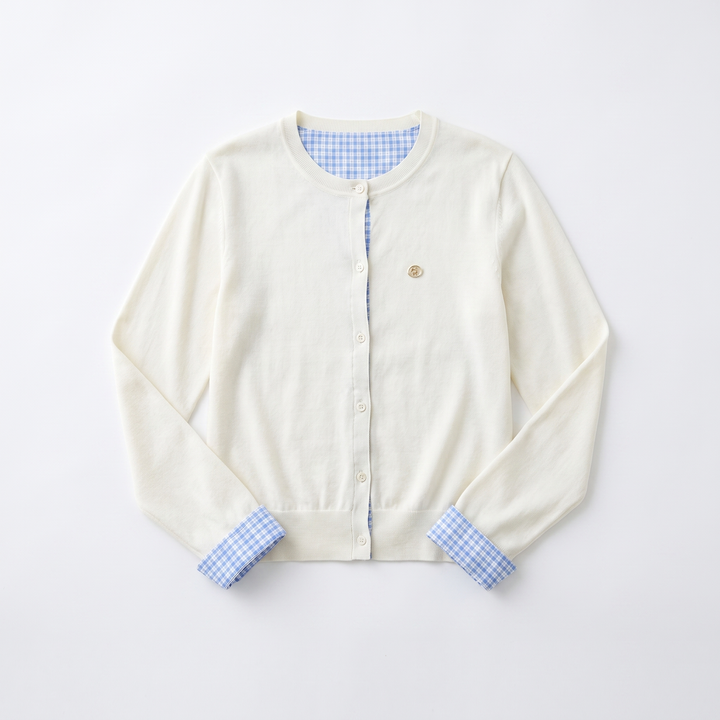 Sunoire vega chang white crew neck blue plaid contrast placket cuff knit cardigan for women fake two piece design small embroidery garment flatlay 01