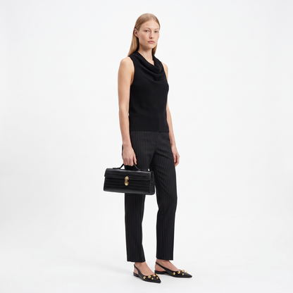 Women's Croc Faux Leather Top Handle Clutch, worn by a model