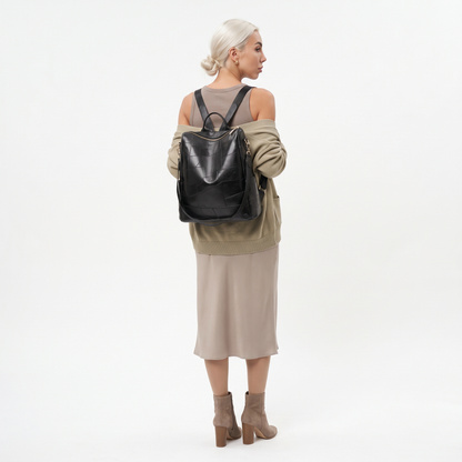 Women's Glossy Faux Leather Patchwork Backpack, worn from behind
