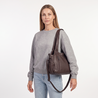 Women's Slouchy Faux Leather Pocket Hobo Bag, worn by a model