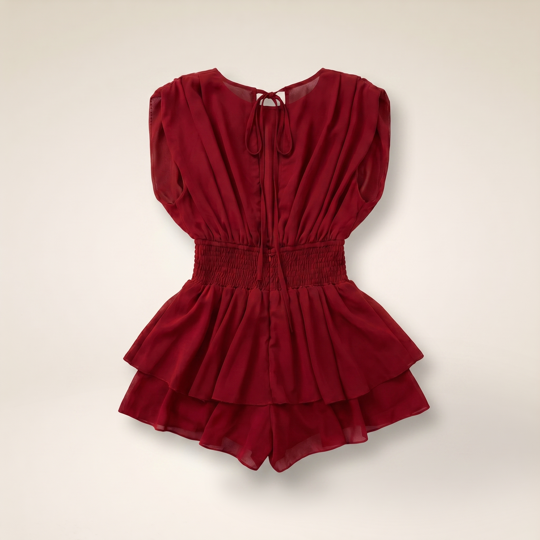 Sunoire womens backless ruffle hem skorts romper elegant tie back shirred pleated jumpsuit colorway red garment flatlay 01