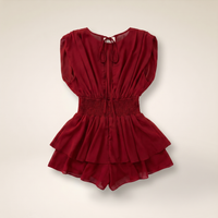 Sunoire womens backless ruffle hem skorts romper elegant tie back shirred pleated jumpsuit colorway red garment flatlay 01