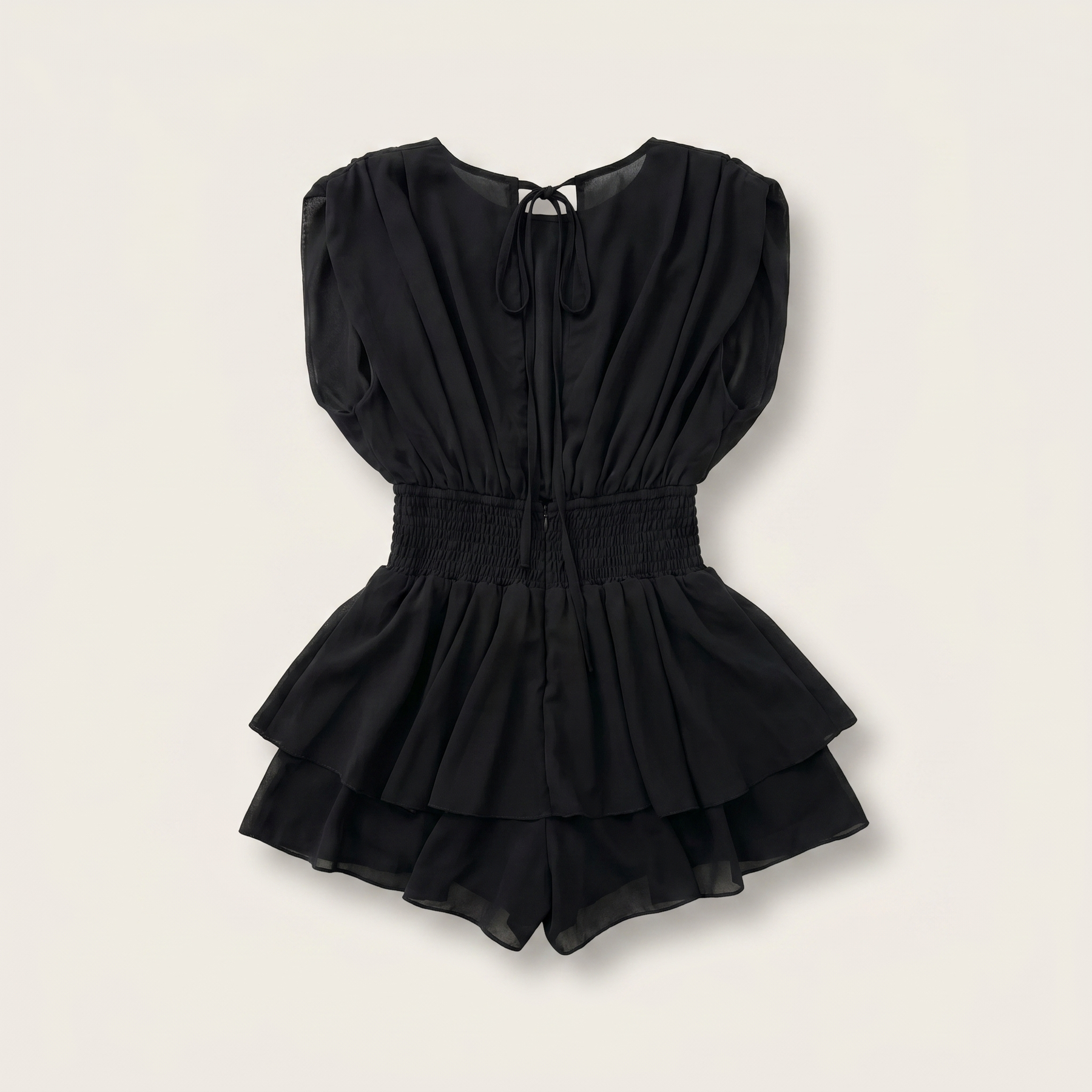 Sunoire womens backless ruffle hem skorts romper elegant tie back shirred pleated jumpsuit garment flatlay 01