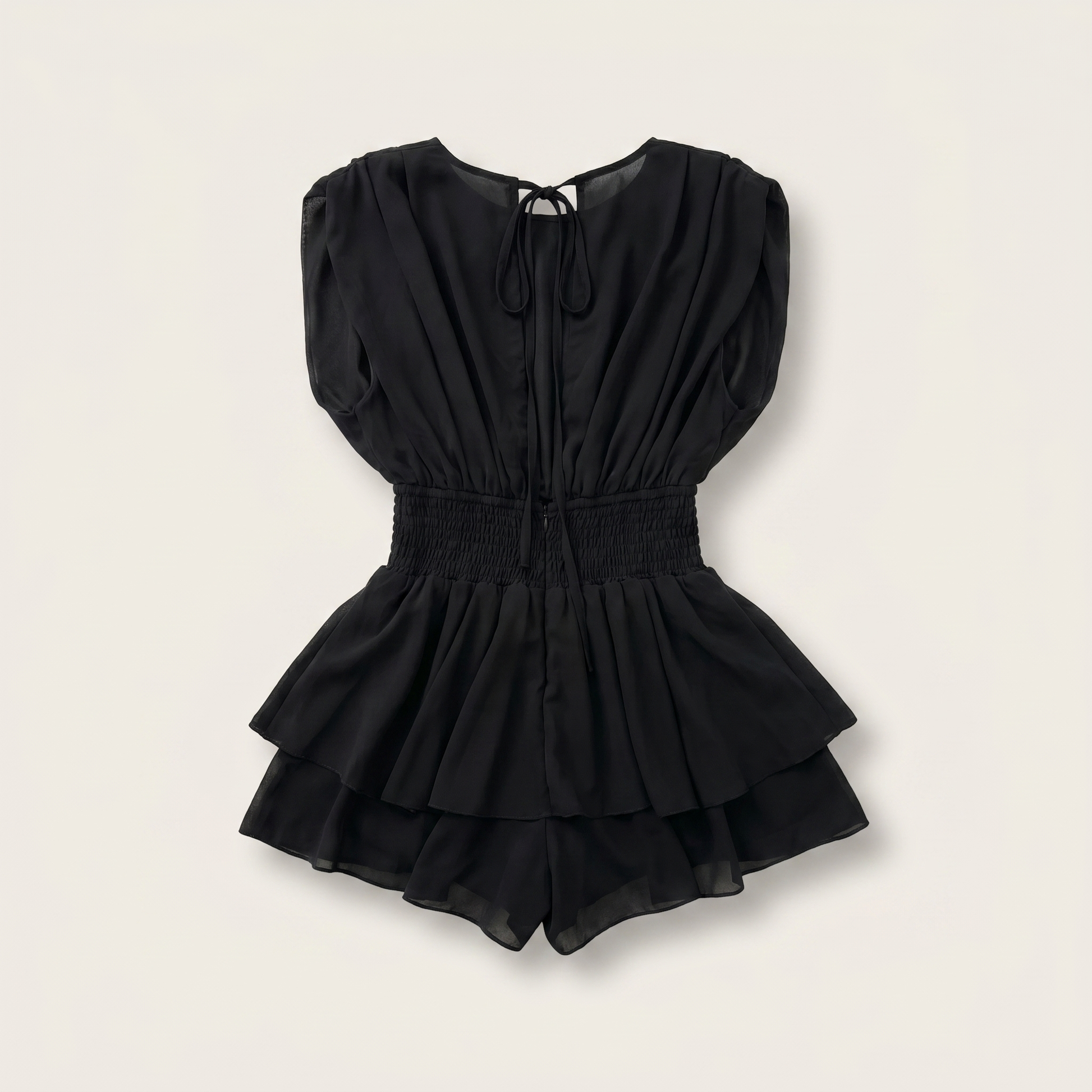 Sunoire womens backless ruffle hem skorts romper elegant tie back shirred pleated jumpsuit garment flatlay 01