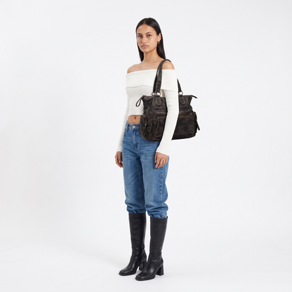 Women's Washed Faux Leather Studded Shoulder Bag, worn by a model